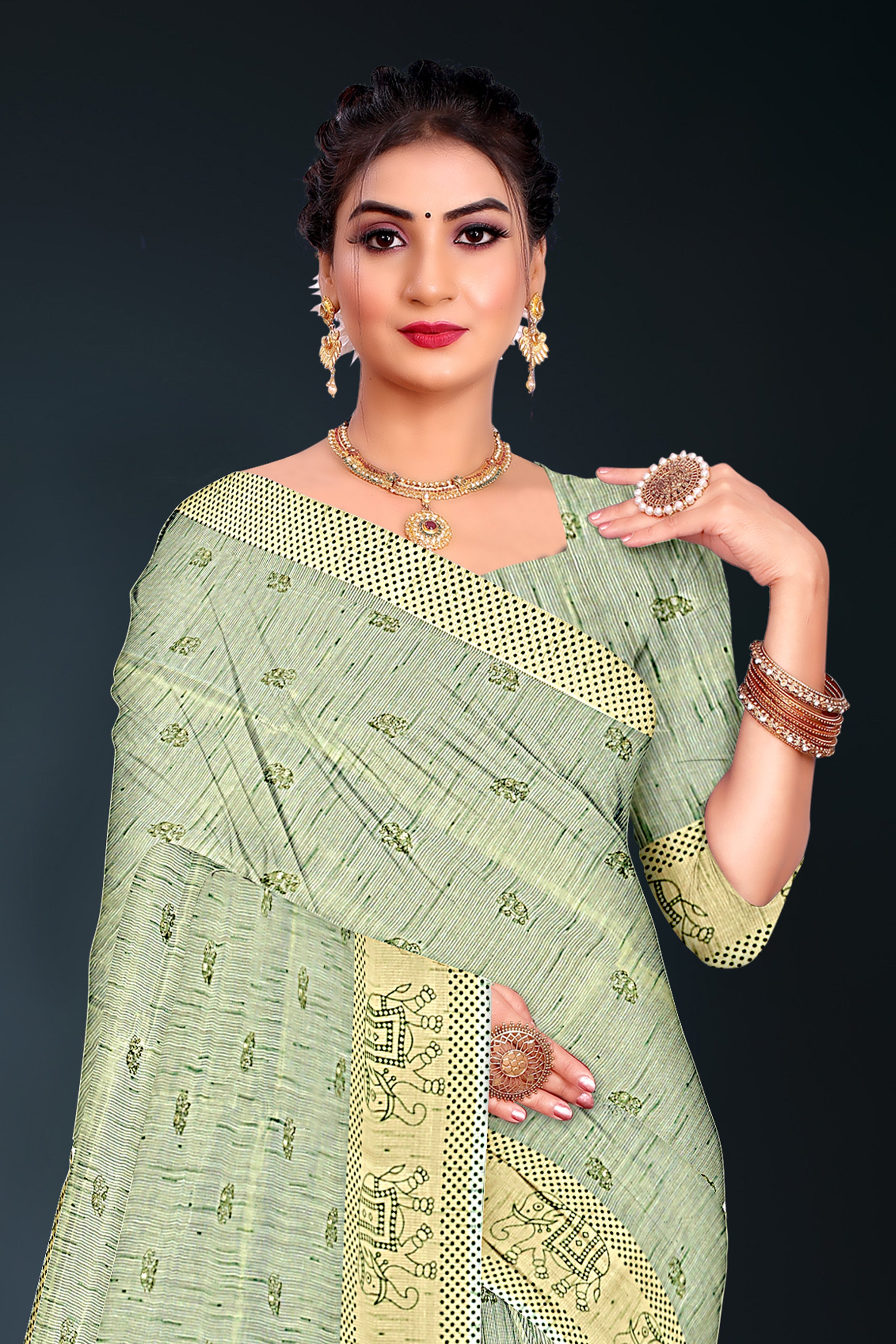 Pastel Green Handloom Cotton Saree with Tribal Motif Border and Green Tassels