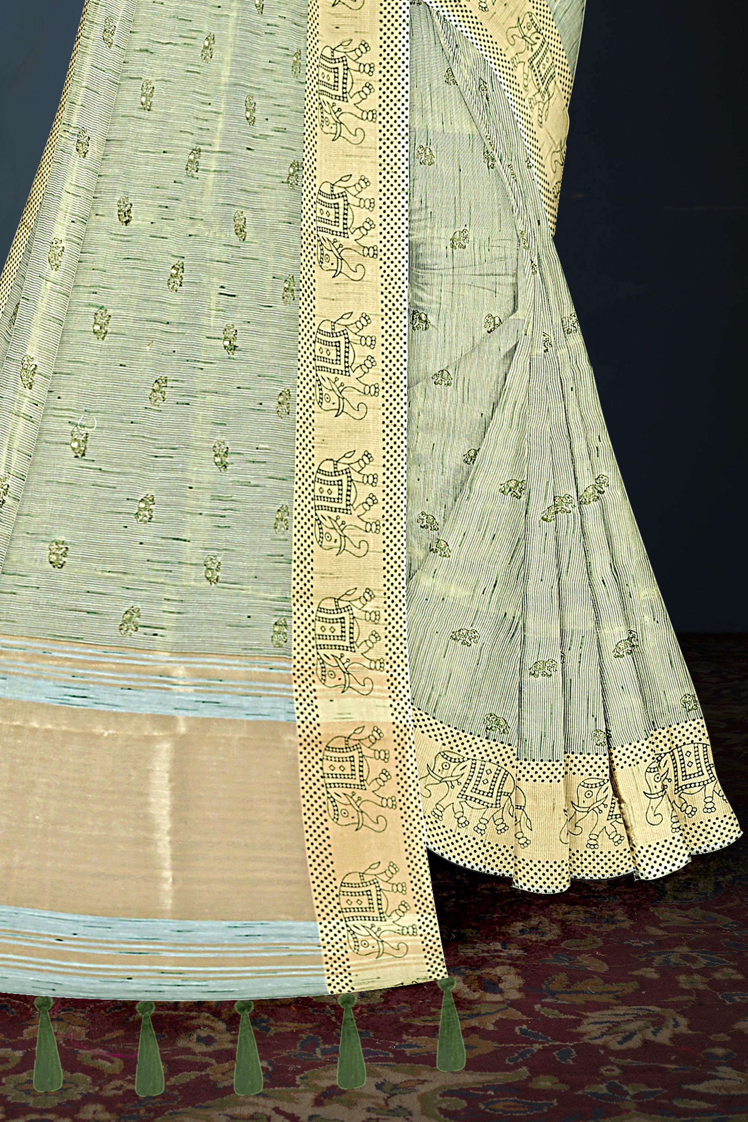 Pastel Green Handloom Cotton Saree with Tribal Motif Border and Green Tassels